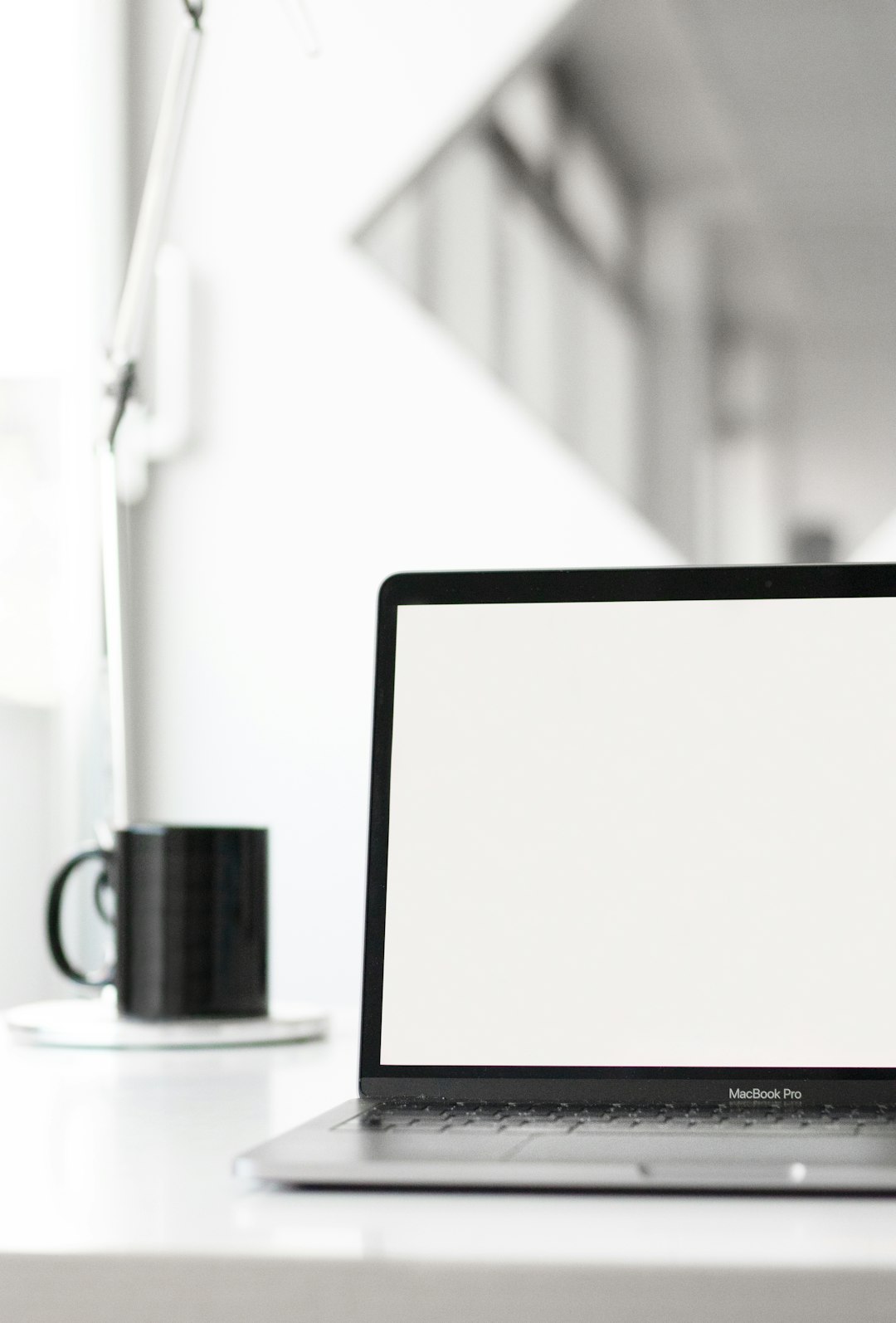 Opened MacBook Pro on cleaned desk